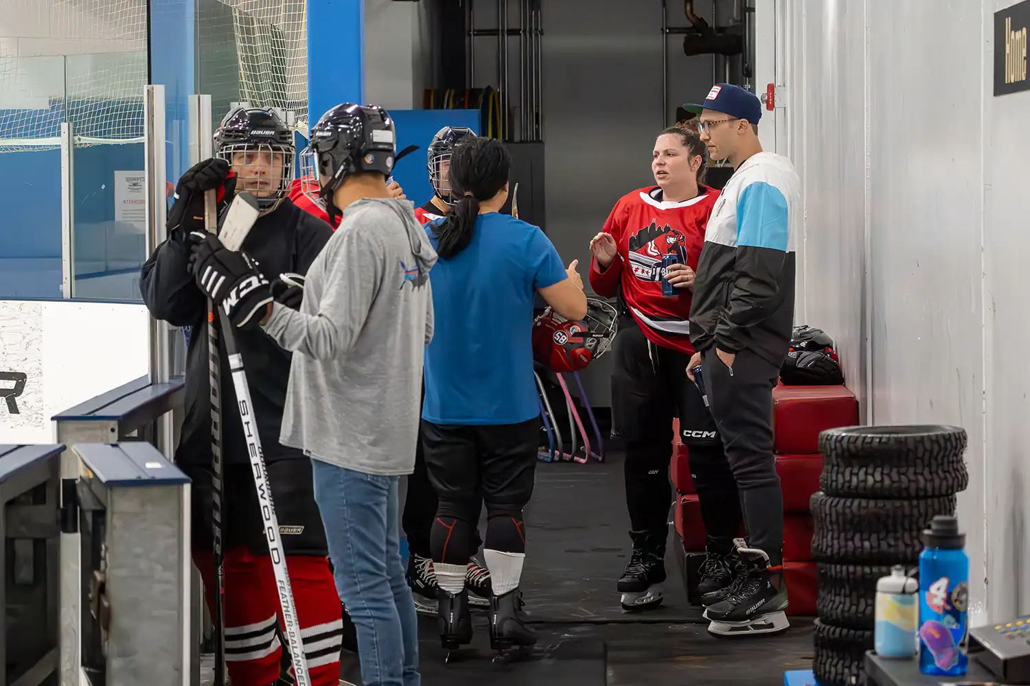 New hockey player getting help on the ice